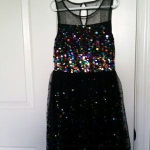 A black  dress with colorful shimmery circle's.